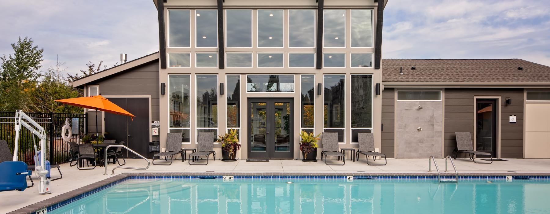 a swimming pool outside of a house