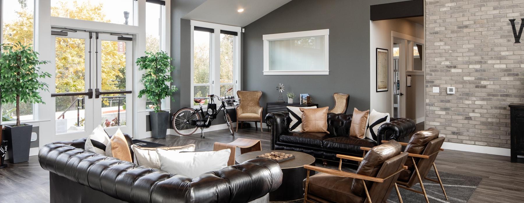 a living room with a couch and chairs