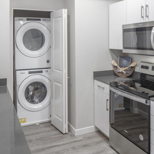 a kitchen with white cabinets