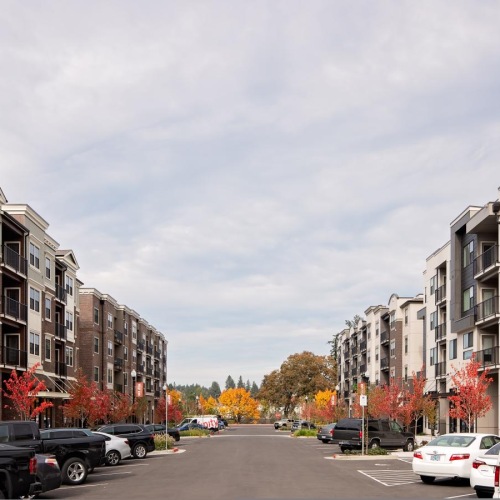 a street with cars and buildings on the side