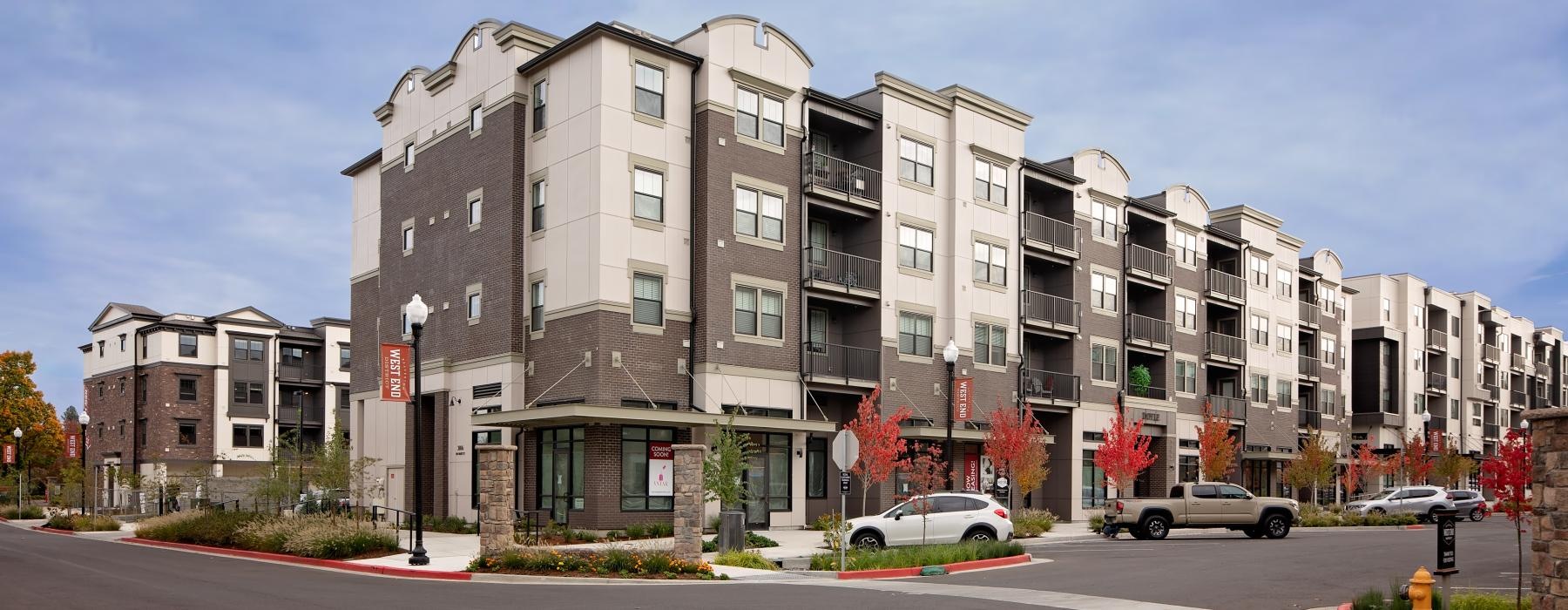 a large building with cars parked in front of it